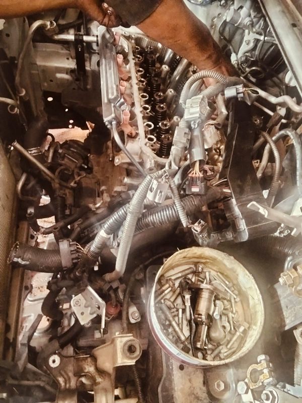 Wiring looms at a stripped engine bay